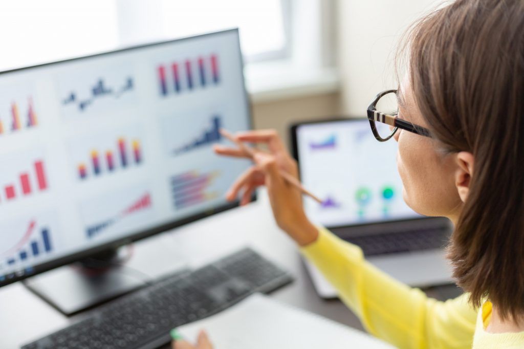 Caucasian advisor financial business analytics woman with data dashboard graphs